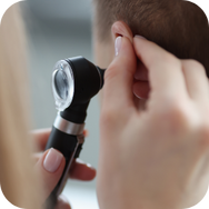 Doctor checking ear